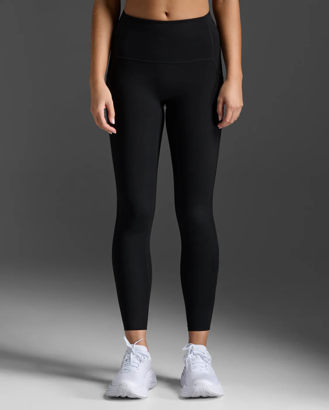 Full-length front view of premium 15-20 mmHg mild compression tights by 2XU in matte black.