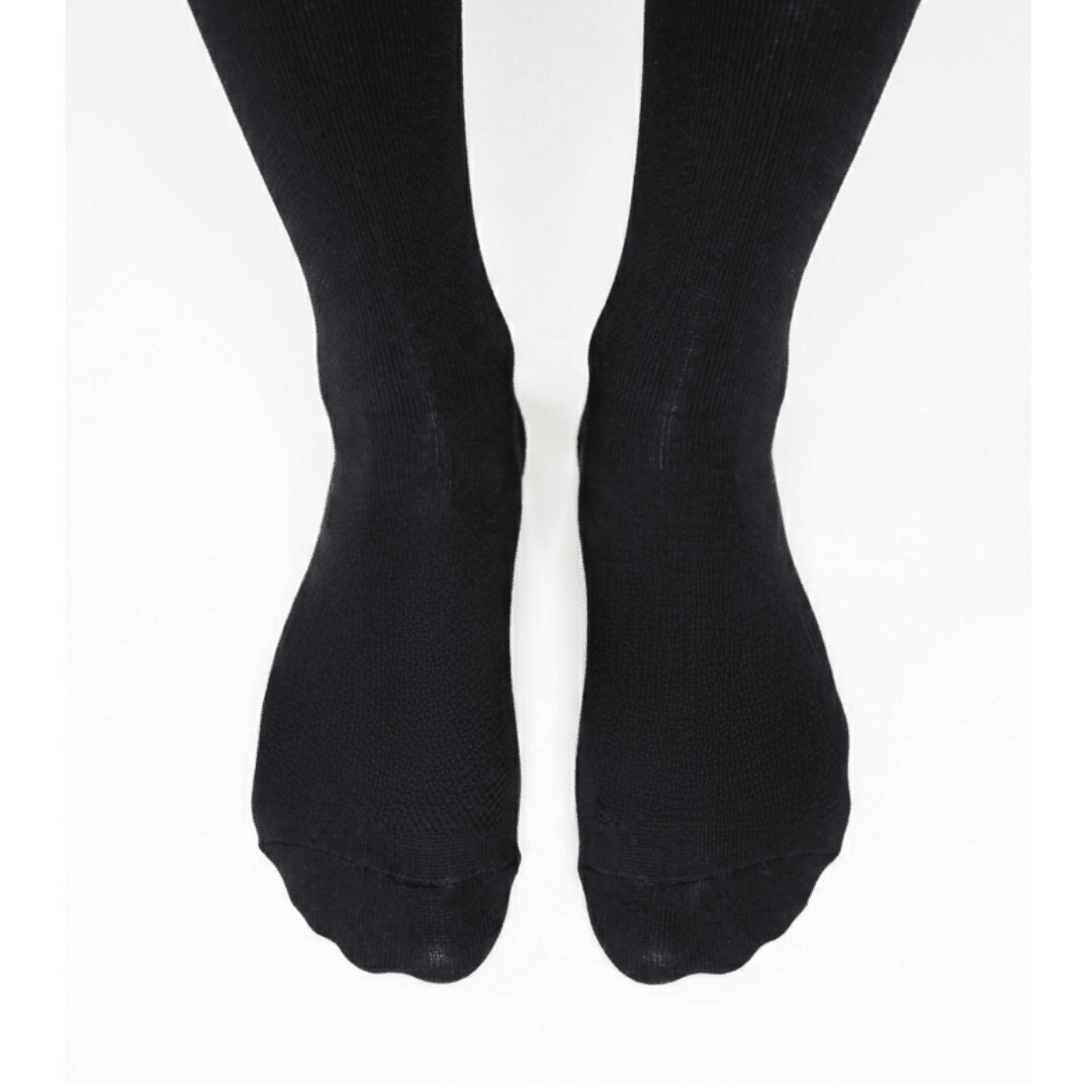 Foot close up YoU Compression ® Black Knee High Socks, 15-20 mmHg mild support for flying and working.