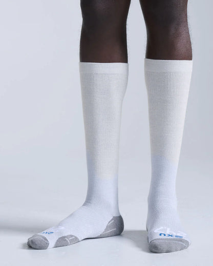 Pair of 2XU 24/7 bamboo knee high compression socks in grey marle and white showing a comfortable, supportive fit.