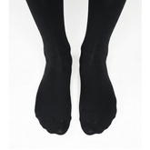 Foot close up YoU Compression ® Black Knee High Socks, 15-20 mmHg mild support for flying and working.