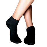 Front and side view of a person wearing YoU Compression black ankle socks featuring a 20-30 mmHg tight, supportive fit on a model against a clean white background.