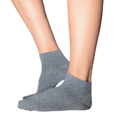 Side view of a person wearing YoU Compression grey marl ankle socks featuring a 20-30 mmHg tight, supportive fit on a model against a clean white background.
